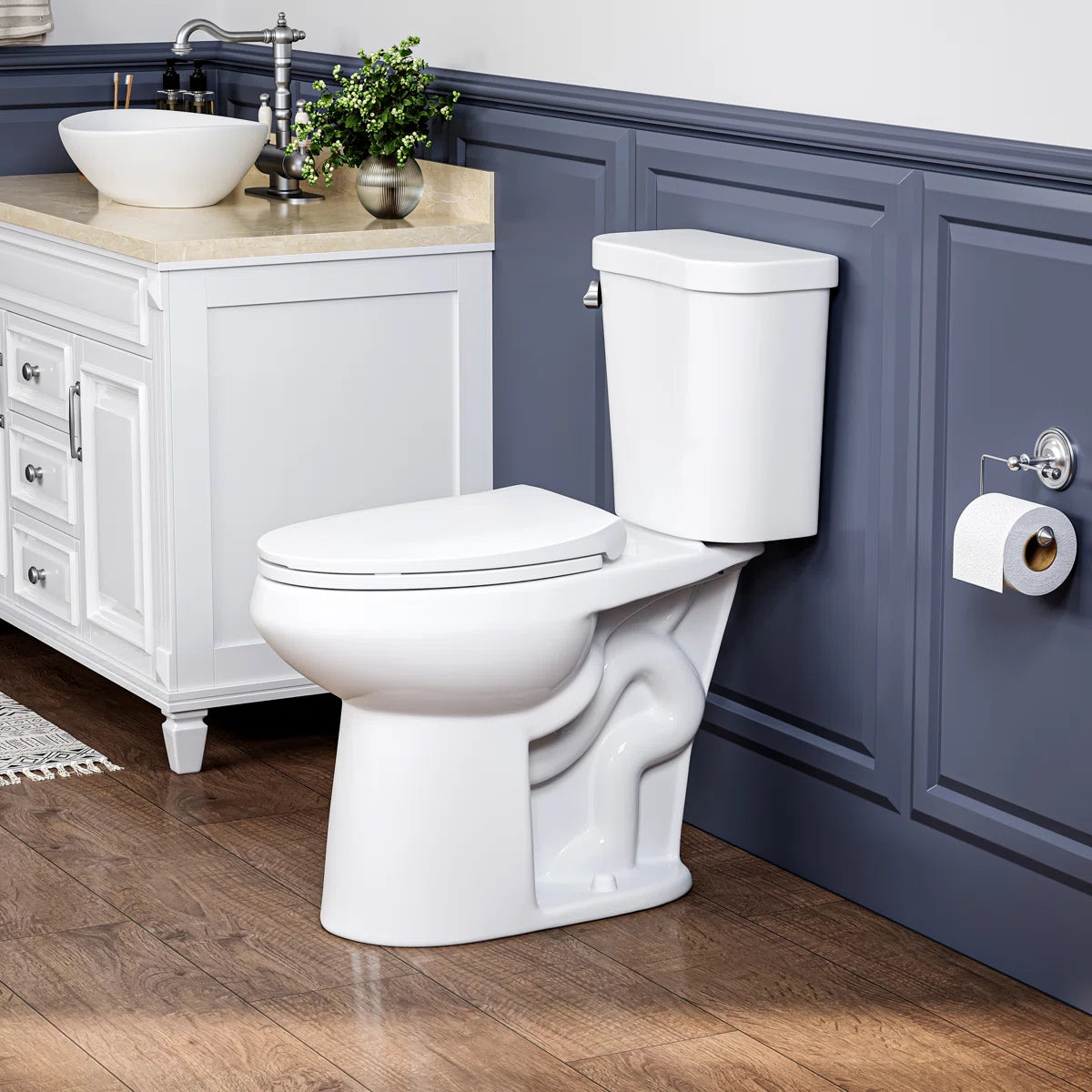 White two-piece elongated ceramic toilet in a modern bathroom.#flush-system_single-flush