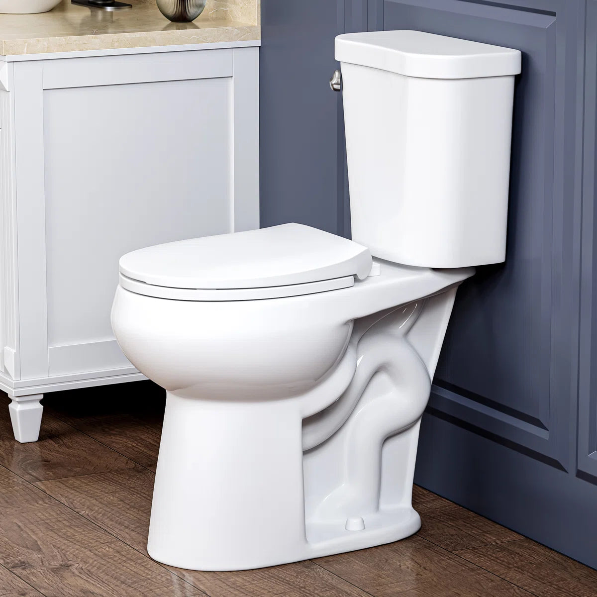White two-piece elongated toilet with side flush handle and soft-close seat.