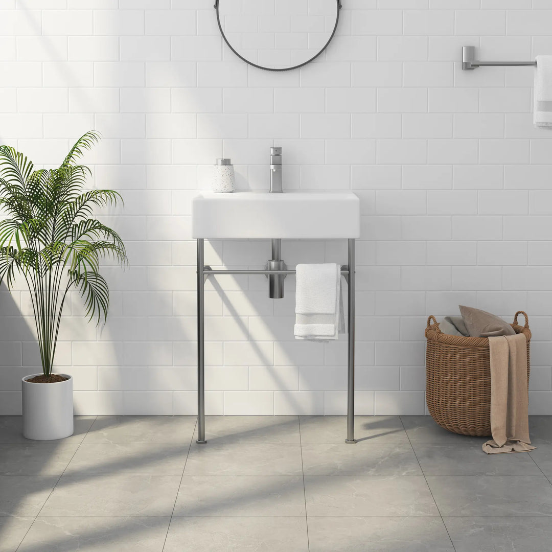 White rectangular ceramic bathroom sink with metal stand and faucet