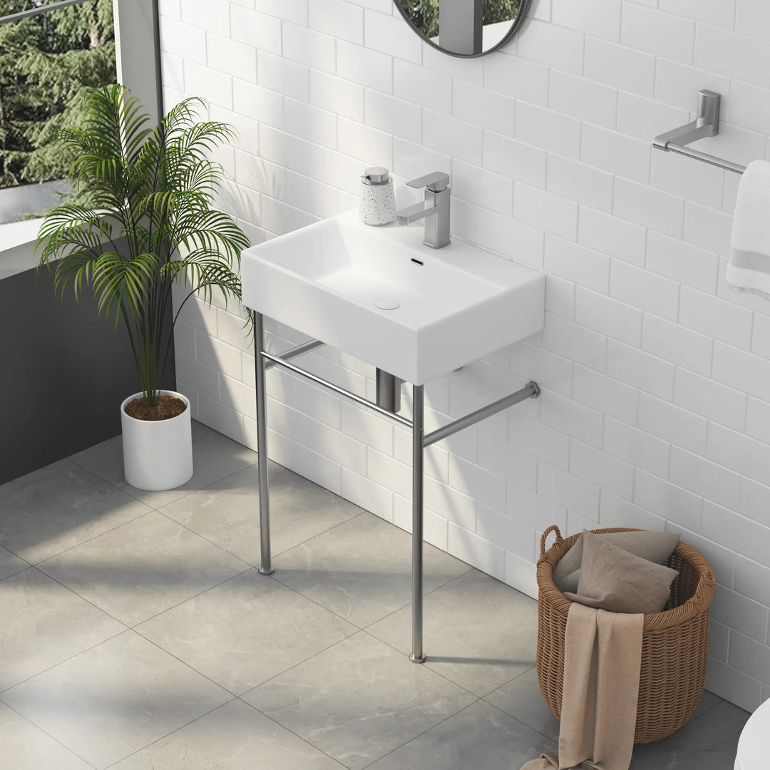 White rectangular ceramic bathroom sink with metal stand and faucet