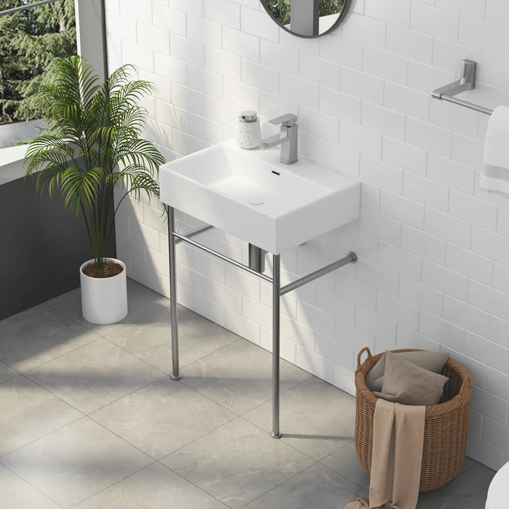 White rectangular ceramic bathroom sink with metal stand and faucet