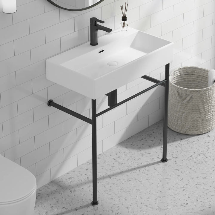 ERIDANUS white ceramic console sink with black legs and towel bar.
