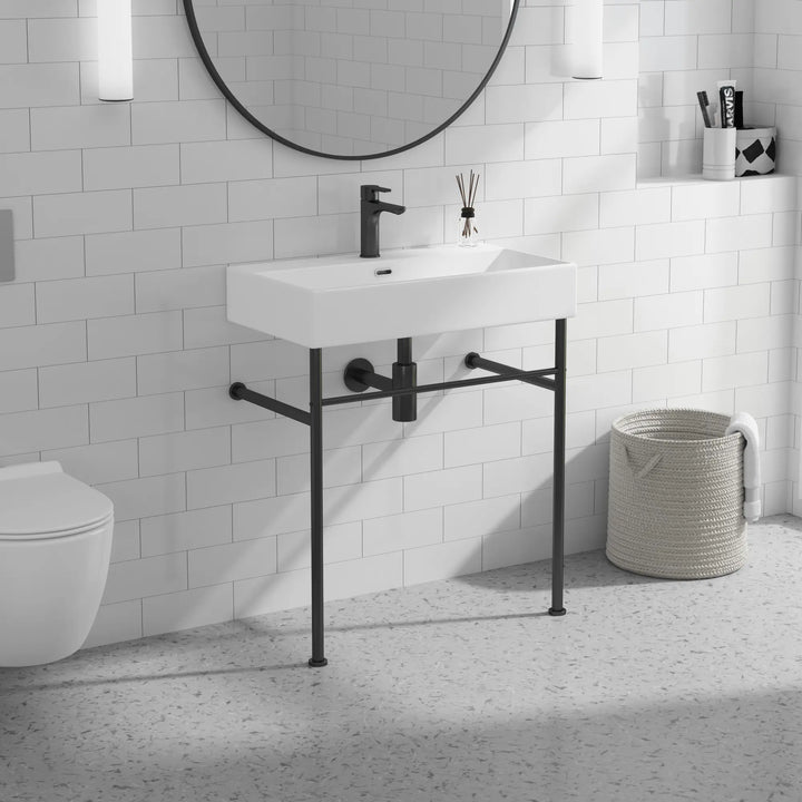ERIDANUS white ceramic console sink with black legs and towel bar.