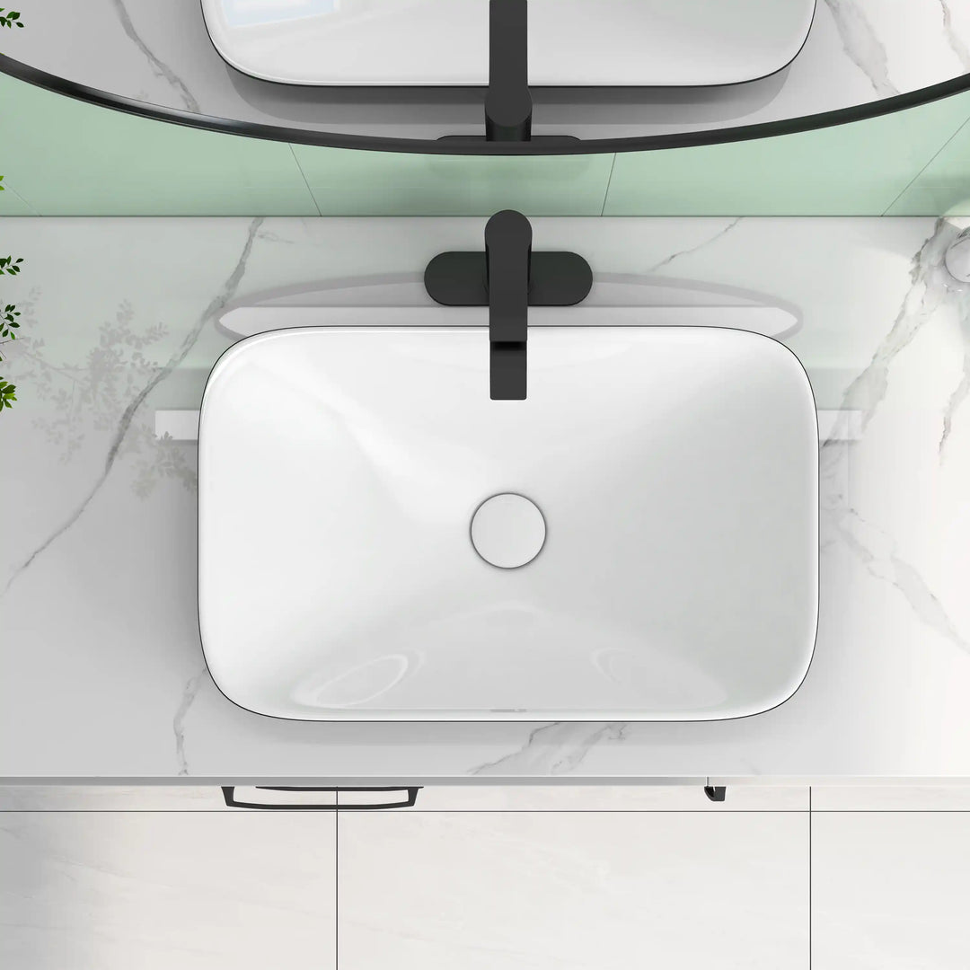 Black rim white rectangular ceramic vessel sink with wall-mounted black faucet