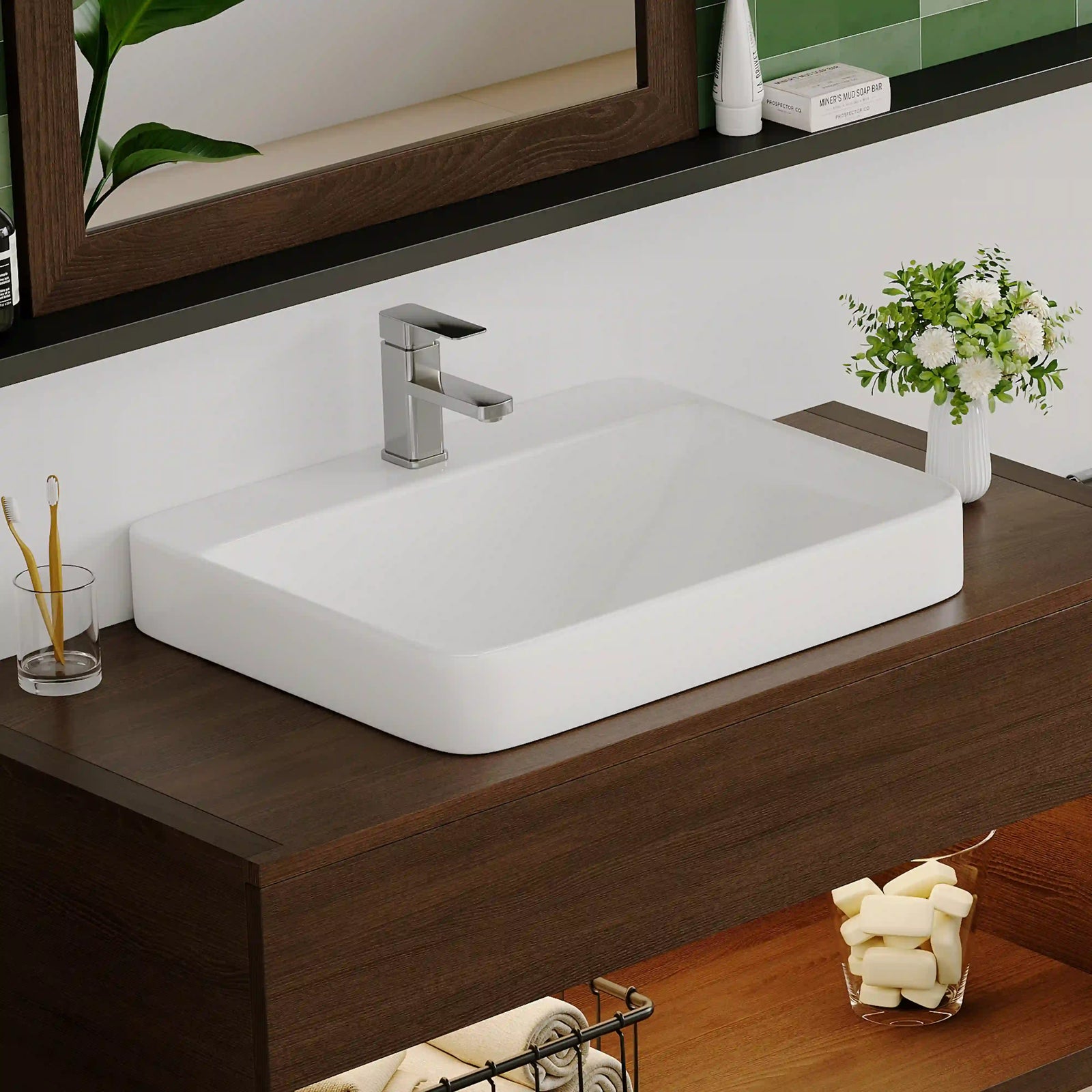 White ceramic rounded rectangular vessel sink with modern chrome faucet