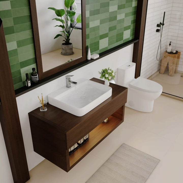 White ceramic rectangular rounded vessel sink with running water chrome faucet