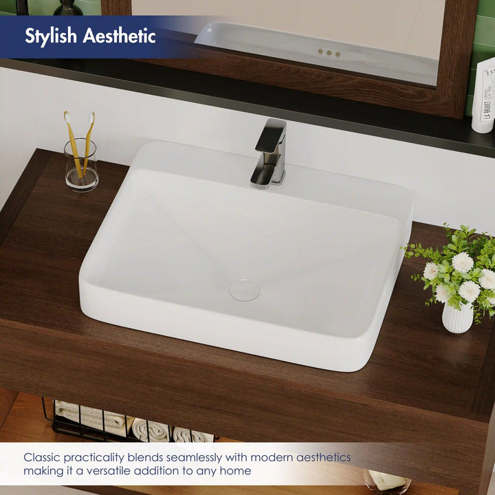 White ceramic rounded rectangular vessel sink with single faucet hole