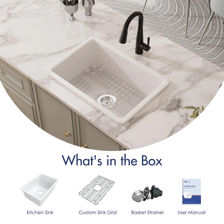 White fireclay kitchen sink with grid, strainer, and manual accessories