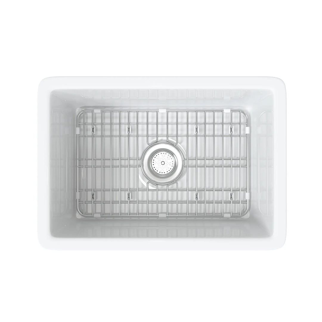 White rectangular fireclay sink with bottom grid and drain