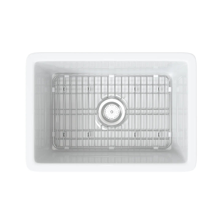 White rectangular fireclay sink with bottom grid and drain