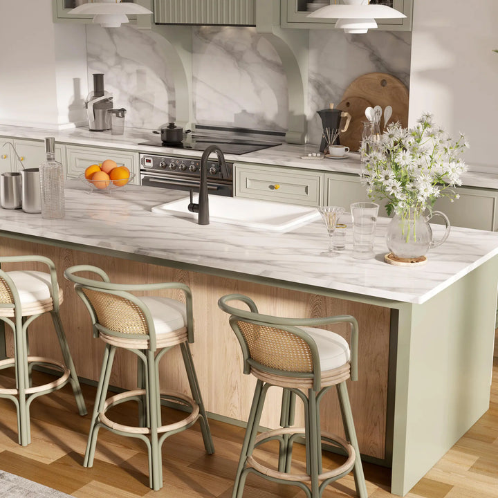 White rectangular fireclay kitchen sink with black faucet on marble countertop