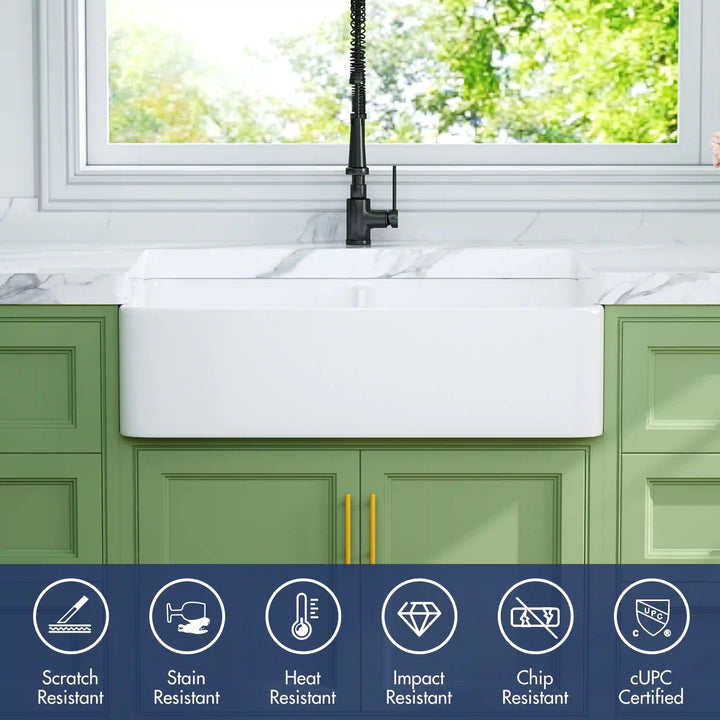 White apron front farmhouse sink with scratch-resistant features and cUPC certification.