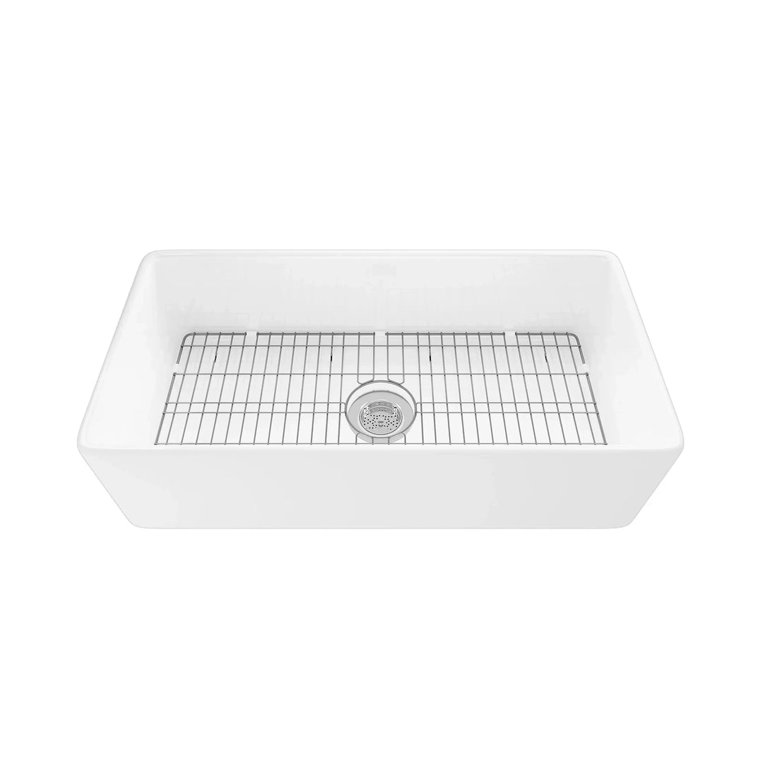 White fireclay single bowl apron front kitchen sink with stainless steel bottom grid