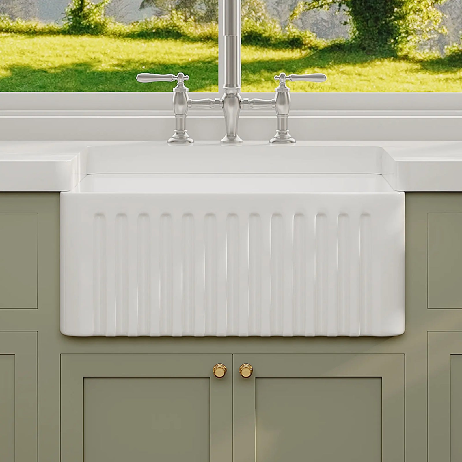 White ceramic farmhouse apron sink with fluted front