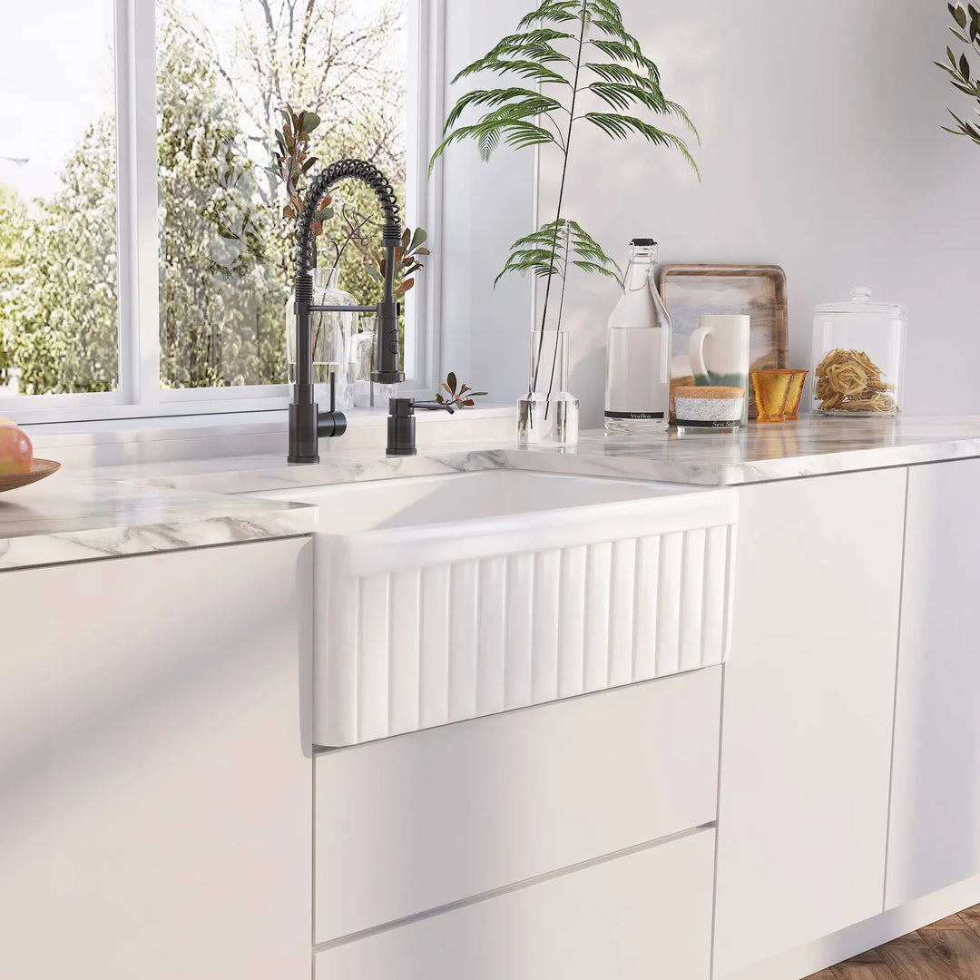 White fireclay farmhouse sink front panel with vertical fluted ribbed texture