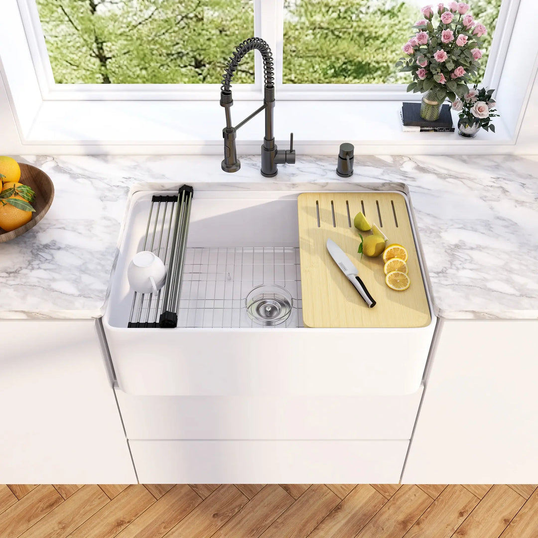 White fireclay double bowl farmhouse sink equipped with drying rack and bamboo cutting board