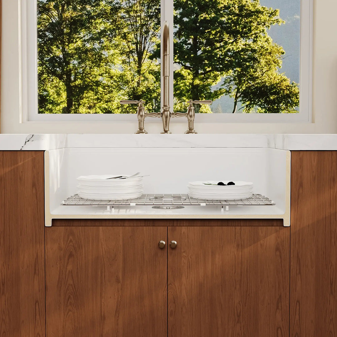White farmhouse sink cutaway showing thick wall and grid