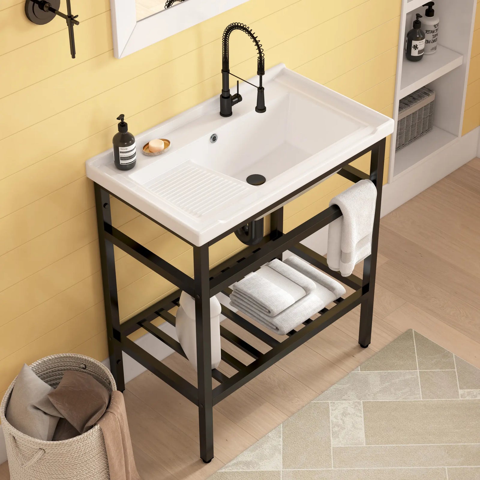 White ceramic sink with washboard and black console stand