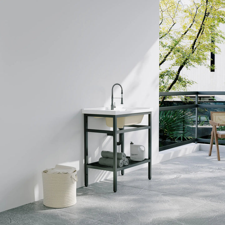White farmhouse sink with black stand and storage shelf