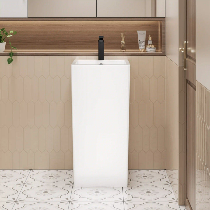 White ceramic freestanding pedestal sink, tall rectangular integrated basin with matte black faucet