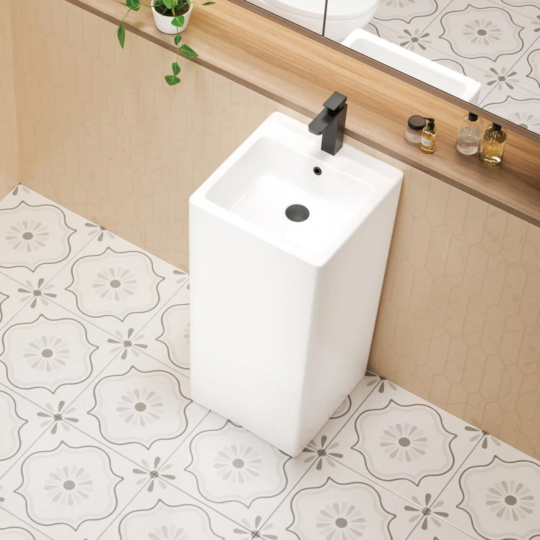White ceramic freestanding pedestal sink, tall rectangular integrated basin with matte black faucet