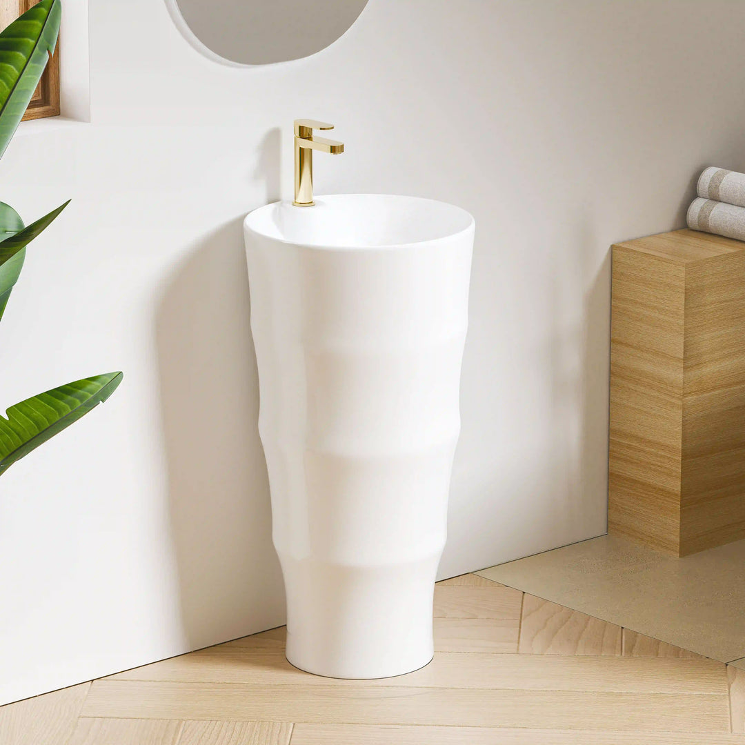 White solid surface bamboo textured freestanding pedestal sink with polished gold faucet