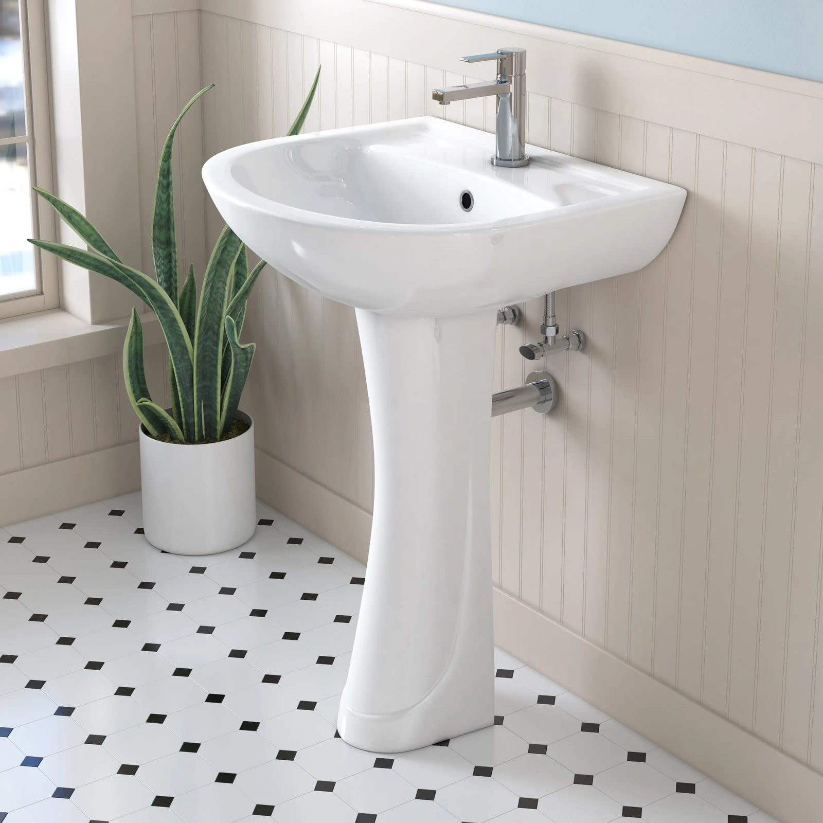 White glossy ceramic pedestal sink with chrome faucet.