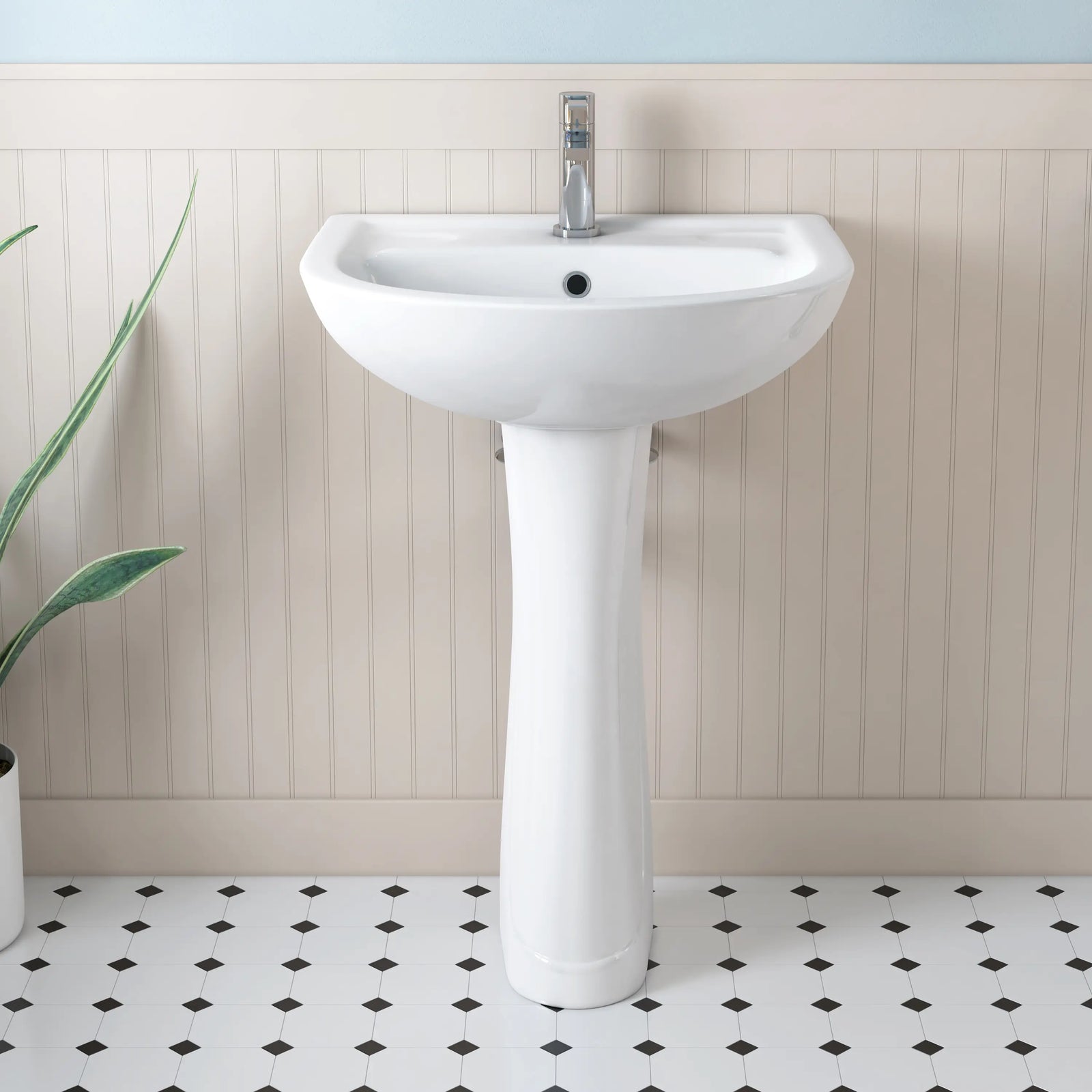 White glossy ceramic pedestal sink with chrome faucet.