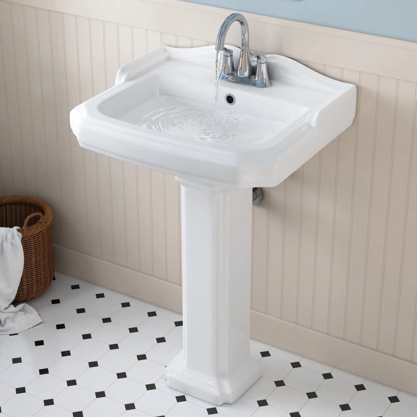 Classic white ceramic pedestal sink with chrome faucet.