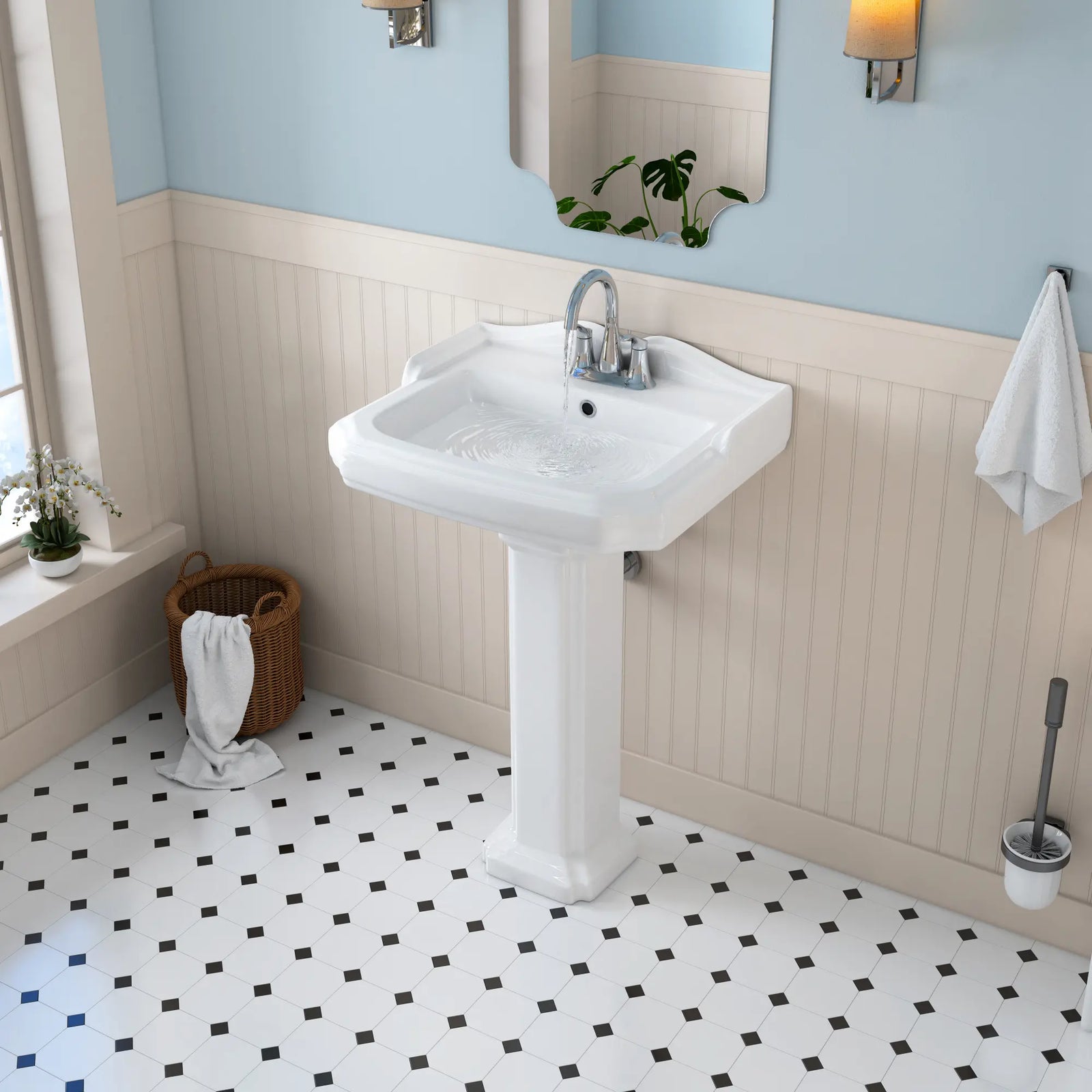 White ceramic pedestal sink with chrome centerset faucet.