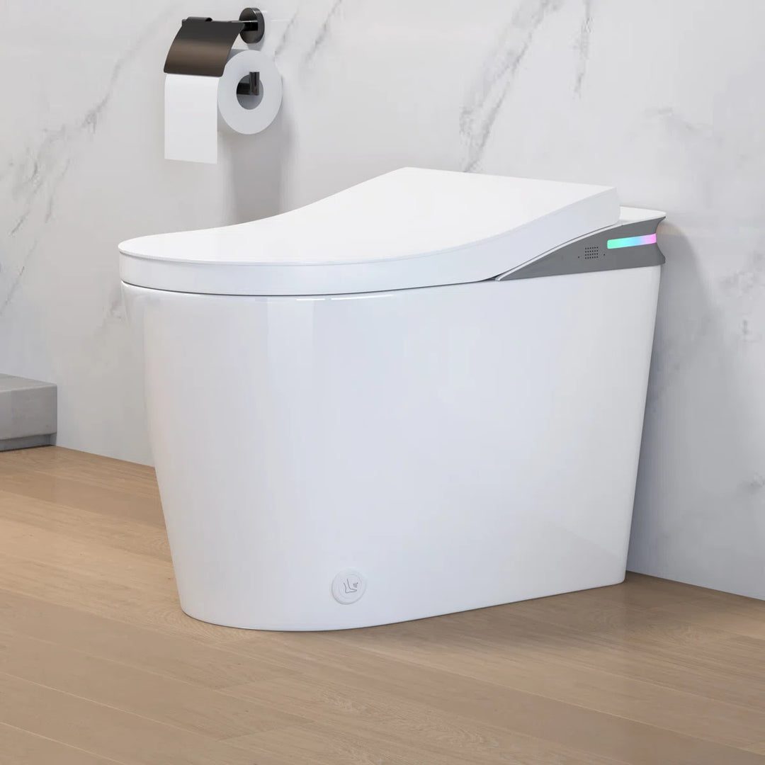 White ceramic one-piece smart toilet with side ambient light panel and bottom control knob, sleek modern design.