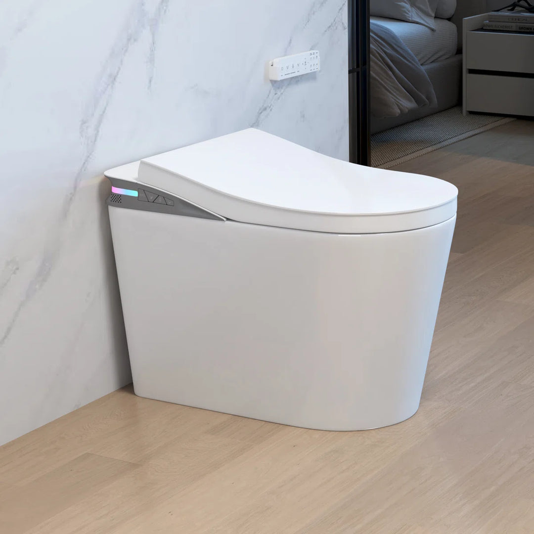 White ceramic one-piece smart toilet with side ambient light panel and bottom control knob, sleek modern design.