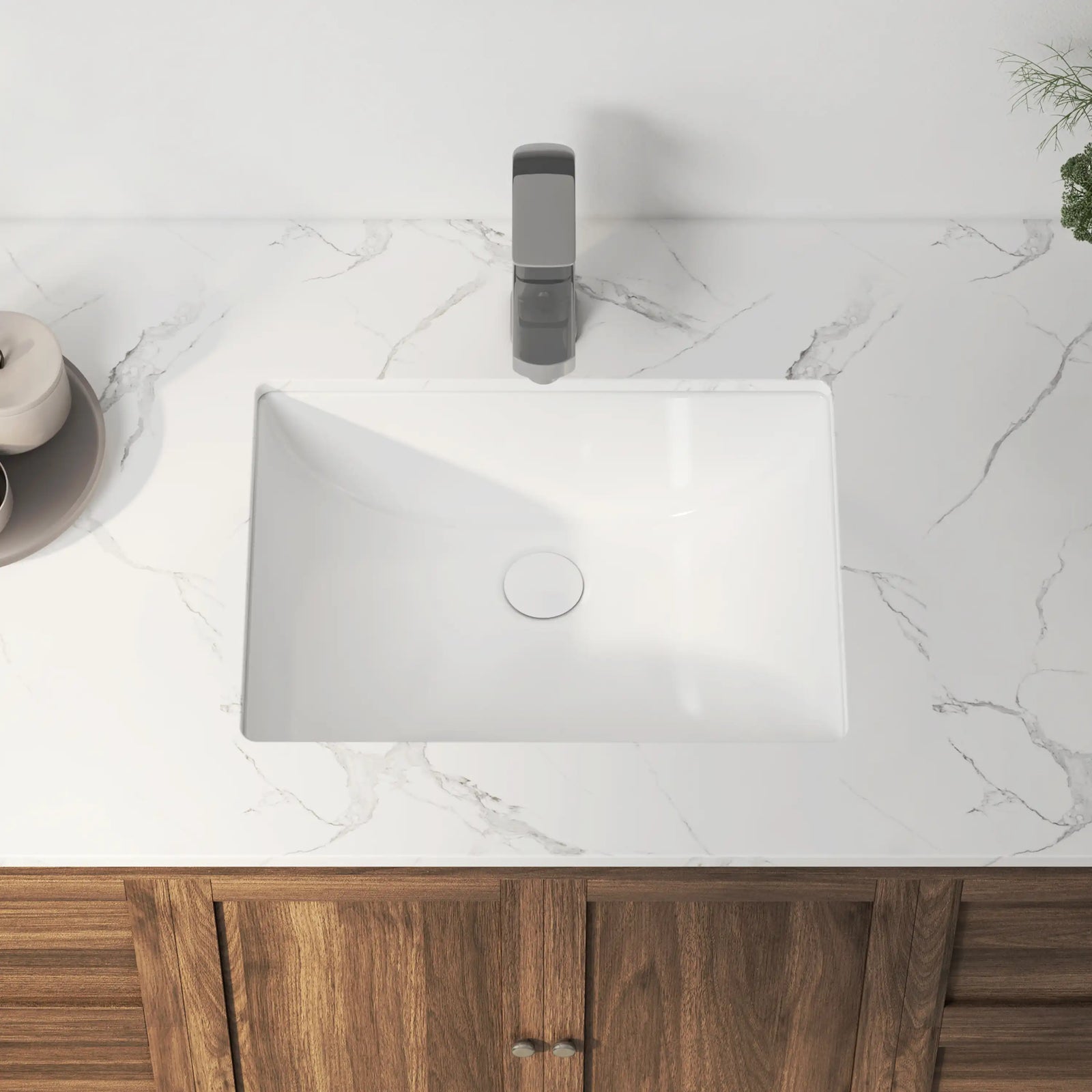 White rectangular ceramic undermount bathroom sink with smooth glaze.