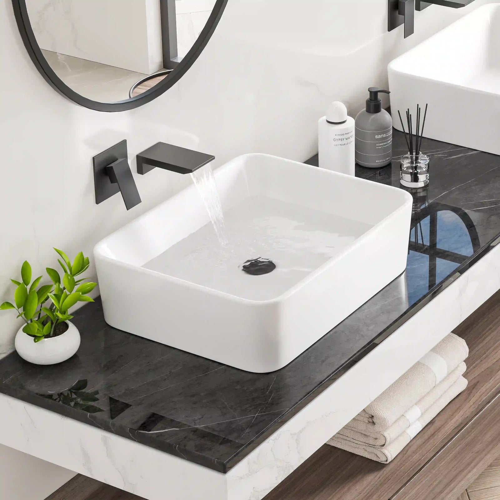 White rectangular ceramic countertop vessel sink with matte black wall-mounted faucet#color_crisp-white