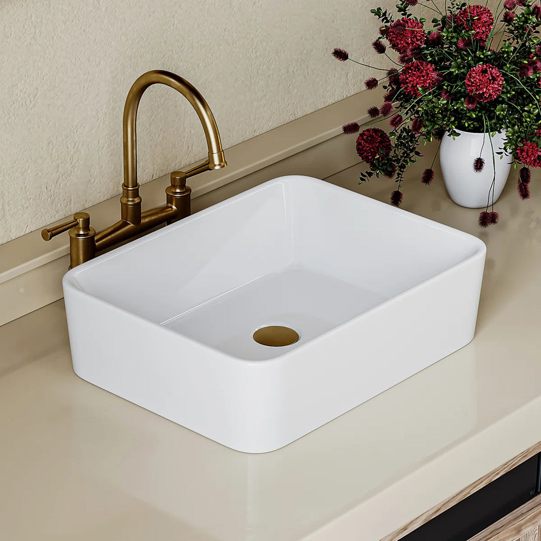 Top view of a white ceramic rectangular vessel sink with rounded corners.