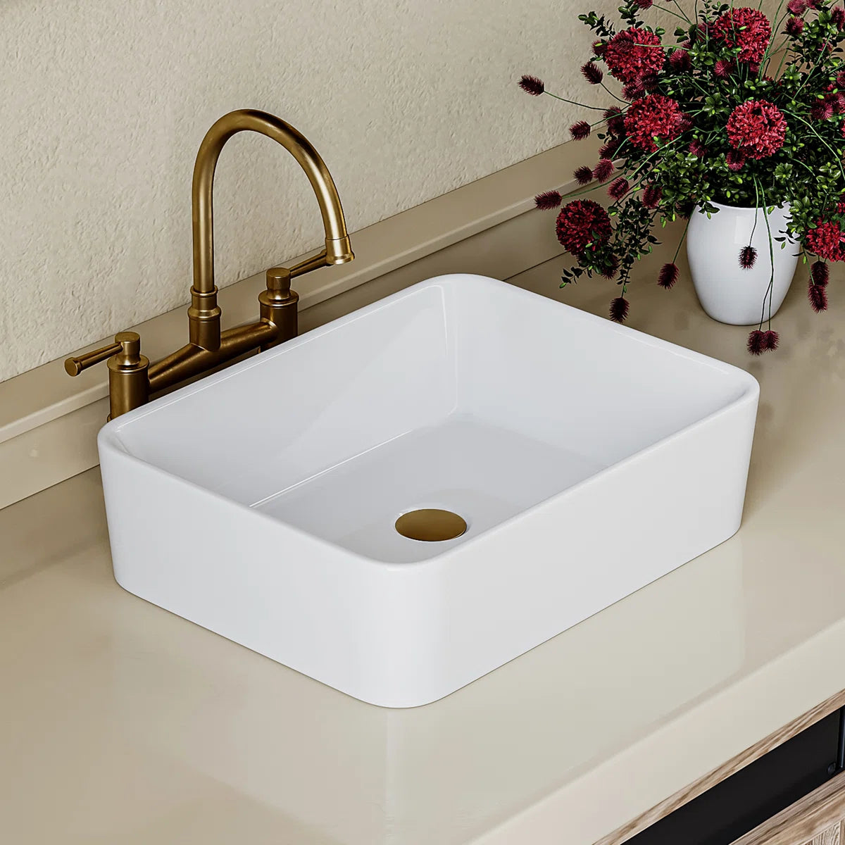 Top view of a white ceramic rectangular vessel sink with rounded corners.