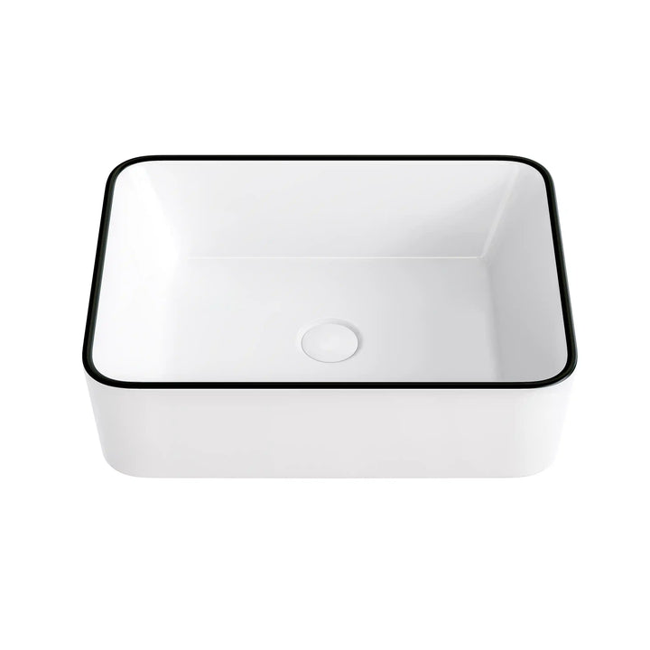White rectangular ceramic countertop sink with thin black edge