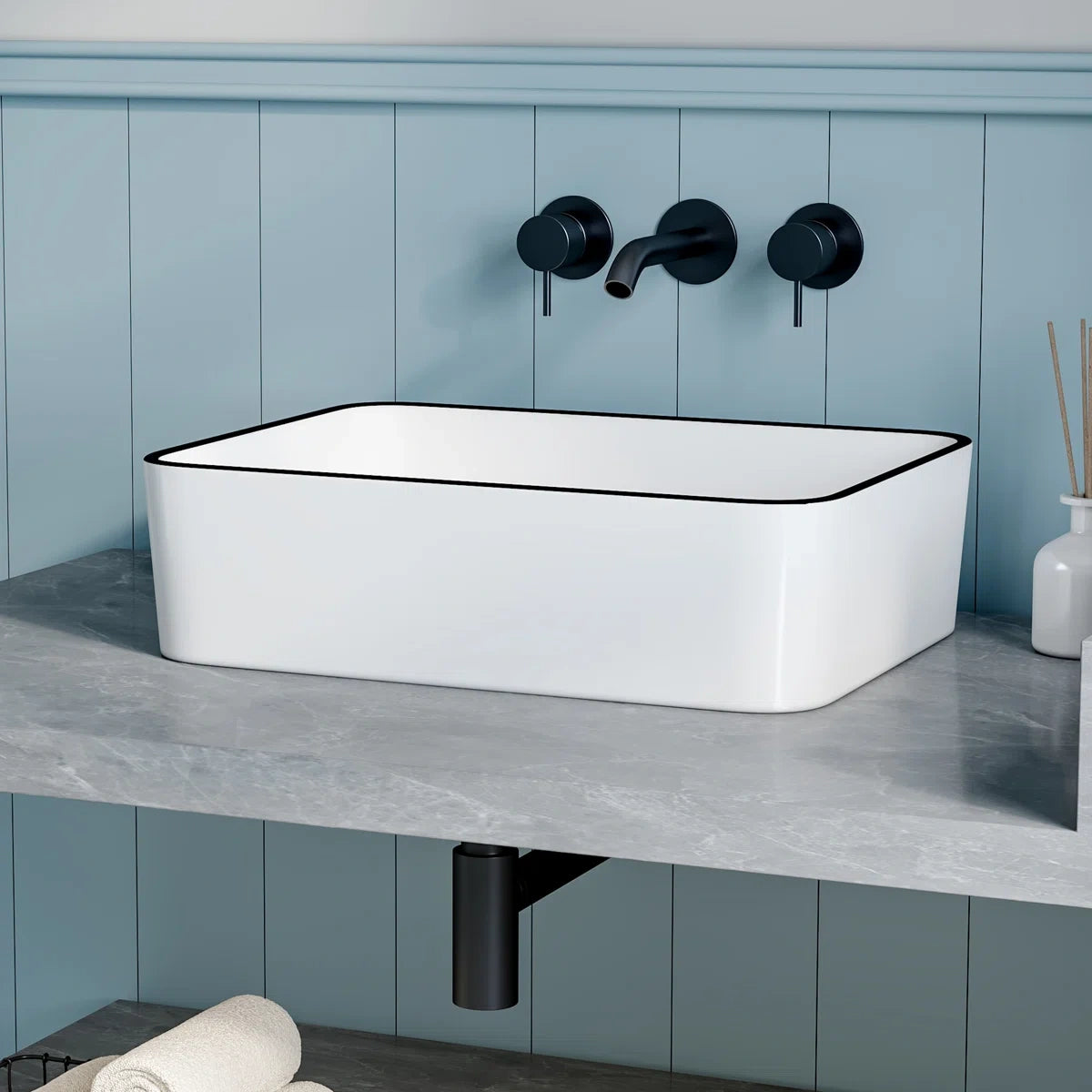 White rectangular vessel sink with modern black rim design.