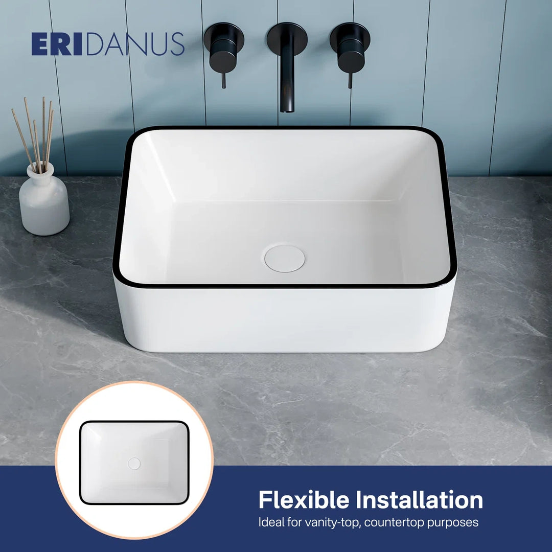 Black rimmed white vessel sink for flexible countertop mounting.