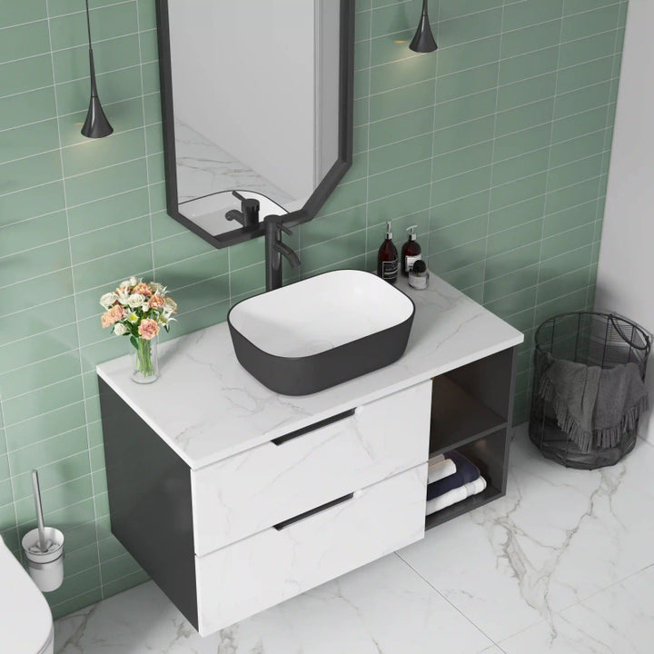 Matte black exterior white interior rectangular ceramic vessel sink with rounded corners