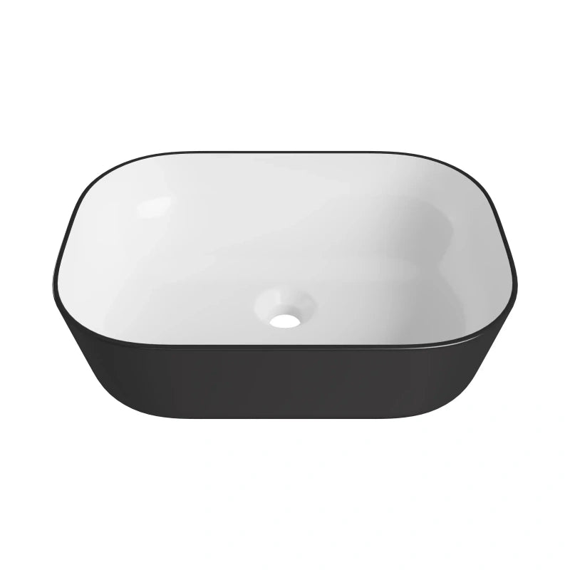 Rounded rectangular ceramic vessel sink, matte black exterior and glossy white interior