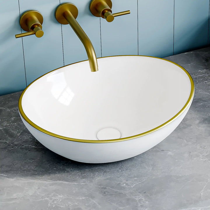 Glossy white oval ceramic vessel sink with thin gold rim border