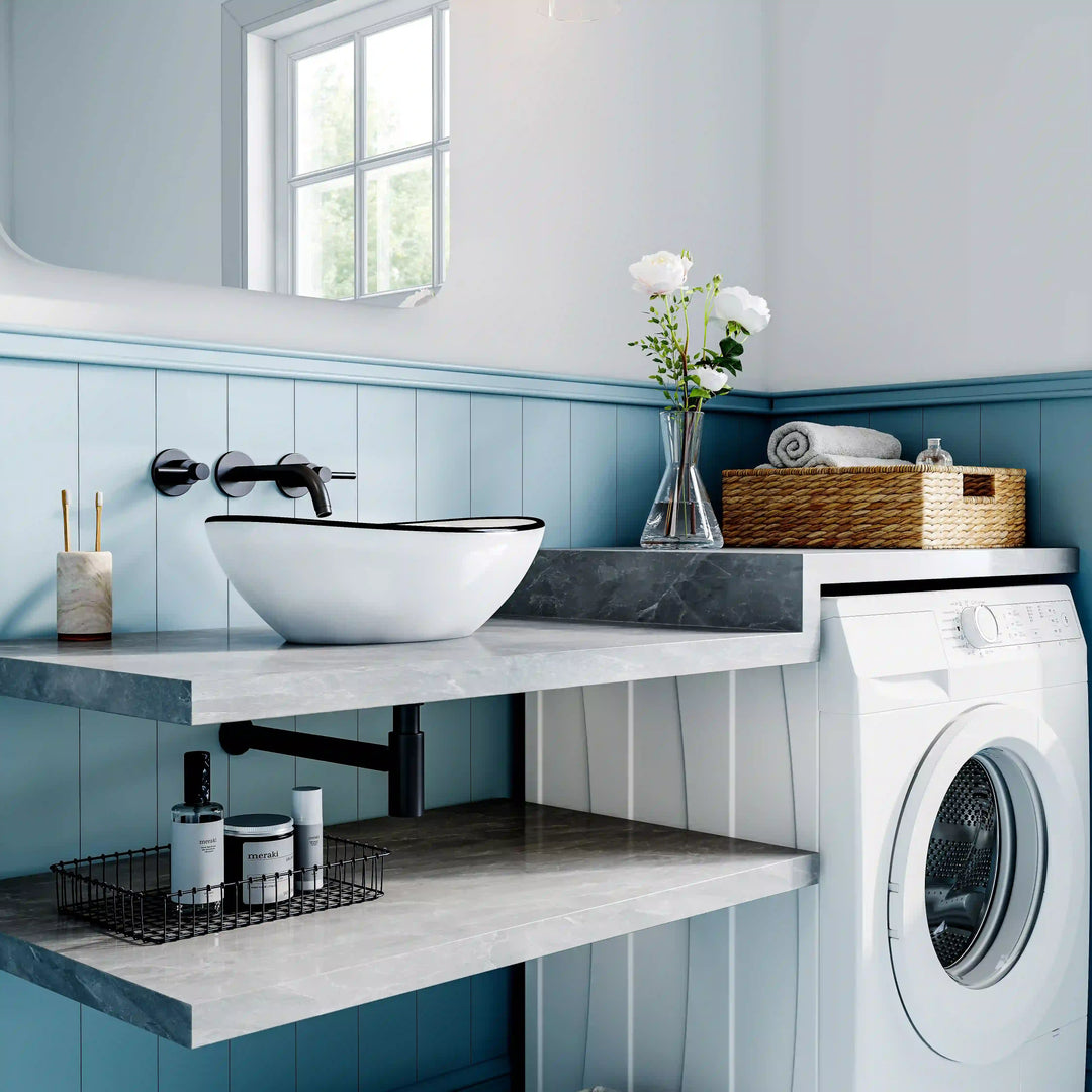 White ceramic oval vessel sink with thin black rim border, modern countertop wash basin