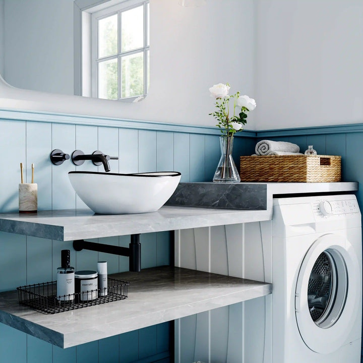White ceramic oval vessel sink with thin black rim border, modern countertop wash basin