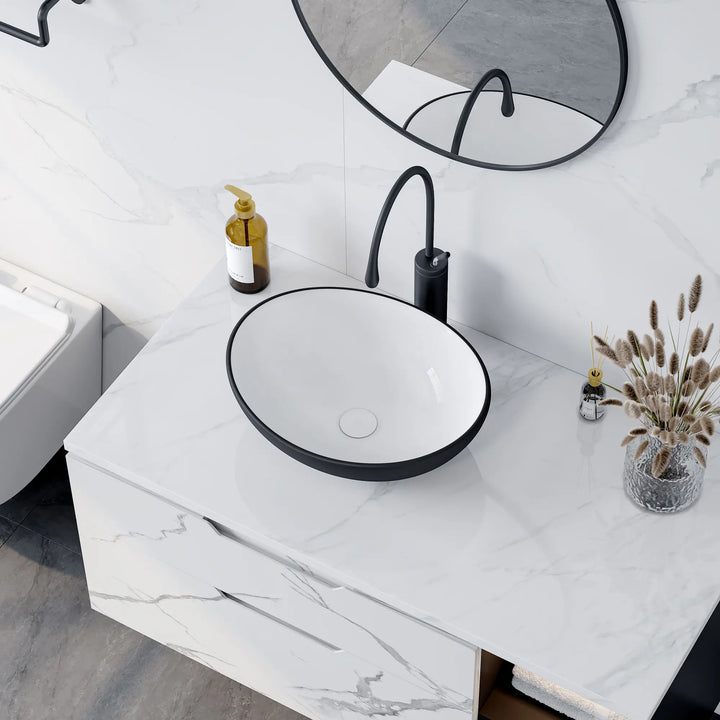 Matte black and white oval ceramic vessel sink