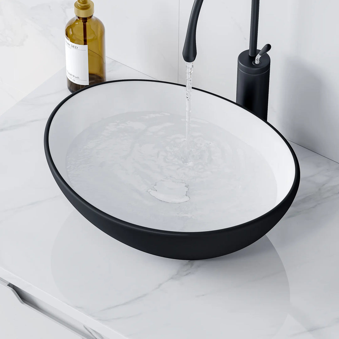 Matte black and white oval vessel bathroom sink
