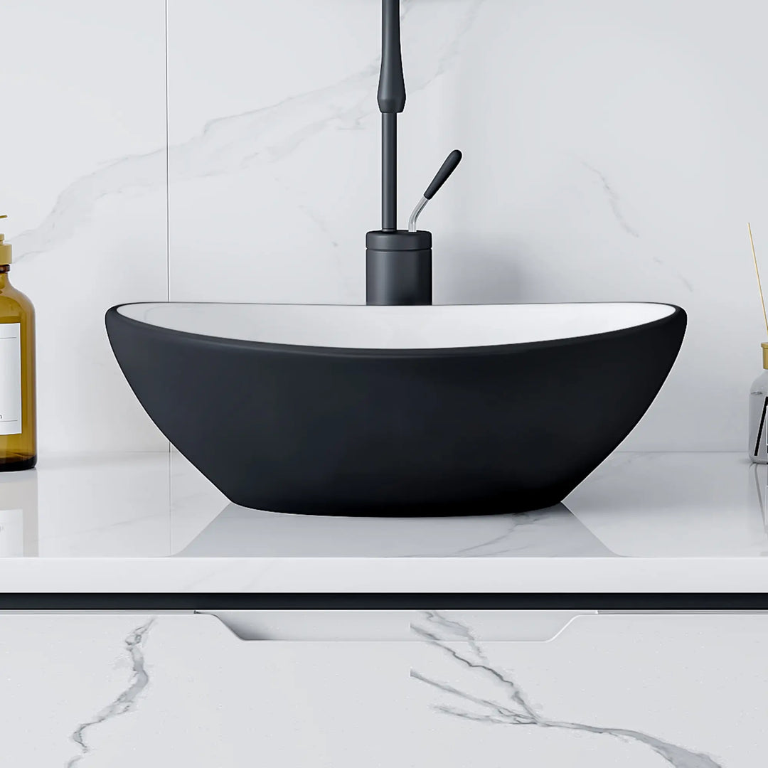 Matte black and white oval vessel bathroom sink