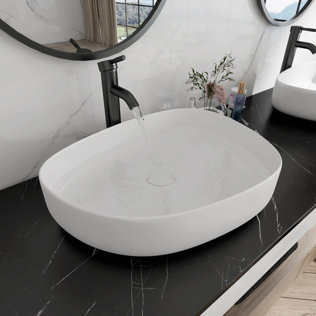 White matte oval ceramic vessel sink with running water, large capacity bathroom countertop wash basin