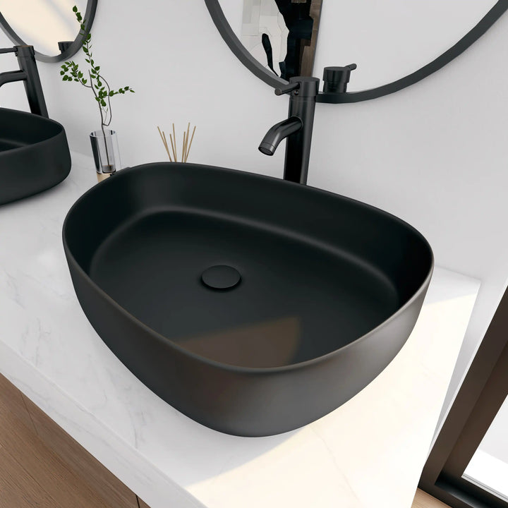 Matte black soft oval solid surface vessel sink