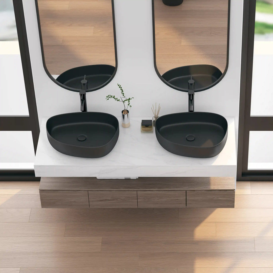 Two matte black oval solid surface vessel sinks double vanity set